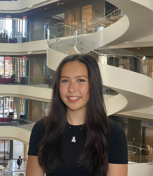Tali Vittum in front of a modern architectural atrium