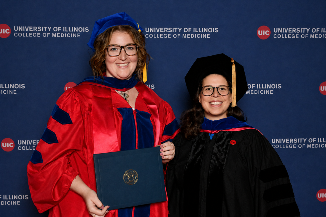 Leanna and Dr. Naba in graduate regalia at Leanna's graduation ceremony